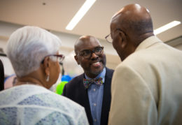 Dr Hutchings talks with guests at Ferdinand T. Day ribbon cutting
