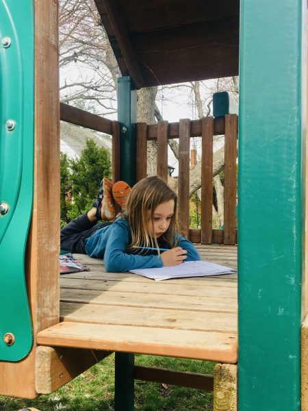 Jacob Neufer, 3rd grader at James K. Polk working on his learning activity packet in and outside the classroom. 