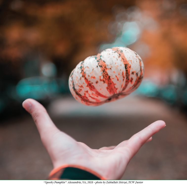 hand extended tossing a small gourd in the air