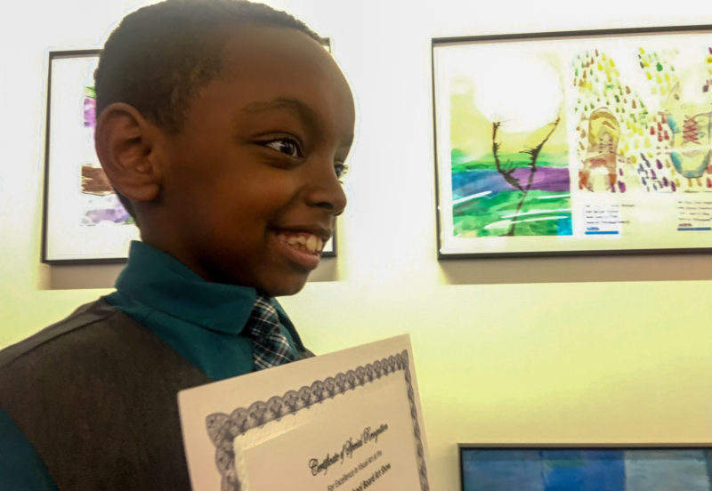 student accepts art award