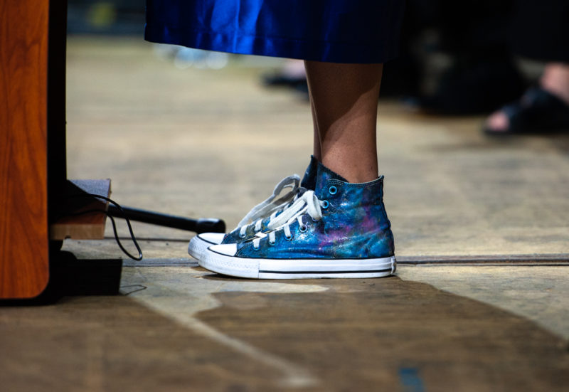 The valedictorian sports space high tops for her speech