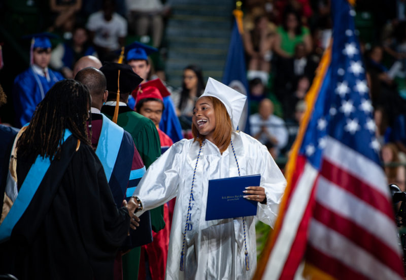 student receives diploma at graduation