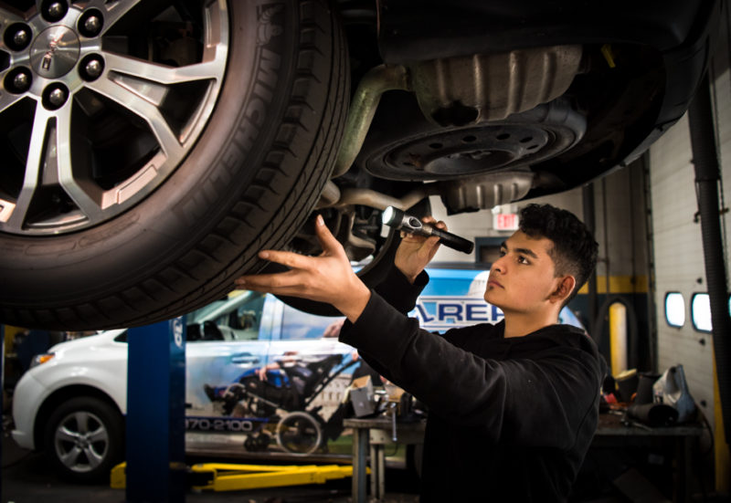 Kevin Alexander inspects the undercarriage of a car at Wiygul Automotive