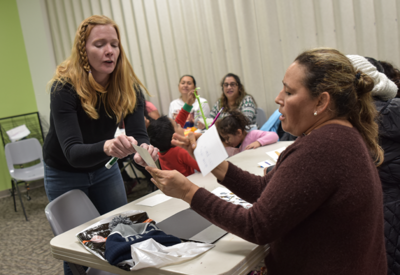 Megan Reing works with a student