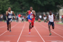 Noah Lyles racing against two other runners