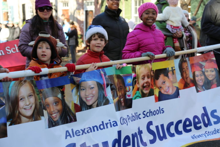 Elementary school students holding Every Student Succeeds banner in Scottish Walk parade