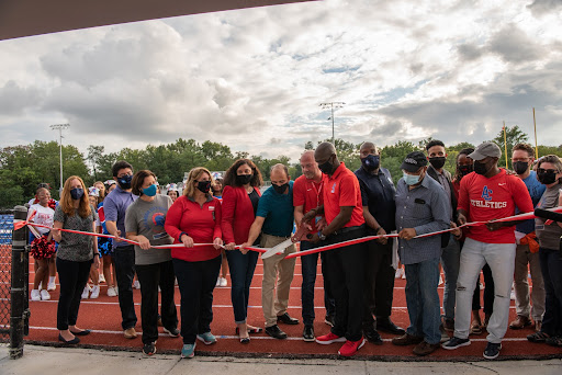 Elected officials, ACPS School Board members and ACPS staff cut a ribbon to open the newly renovated Parker-Gray Memorial Stadium
