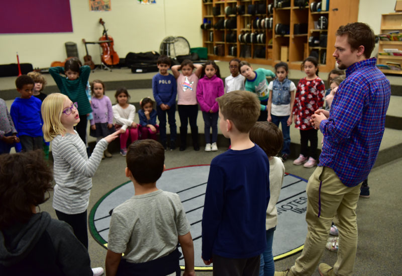 Sympatico Program Director Kyle Tilman working with members of the Cantamos ensemble.