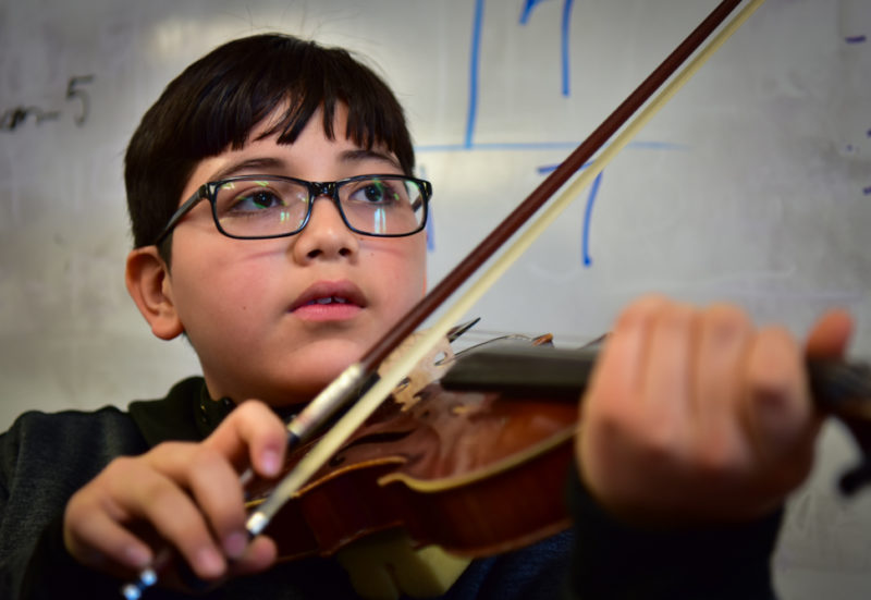 Fifth-grader Eddy Paz is a member of the Fiddle Factory ensemble