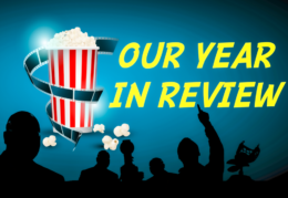 silhouettes against a movie screen that says Our Year in Review