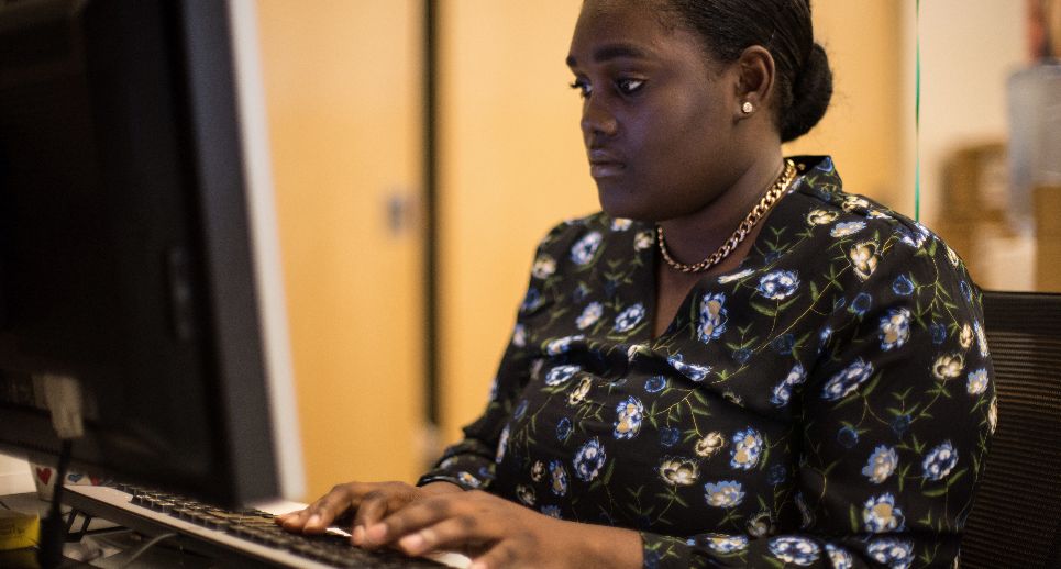 Woman working at a computer