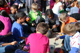 Students painting outside