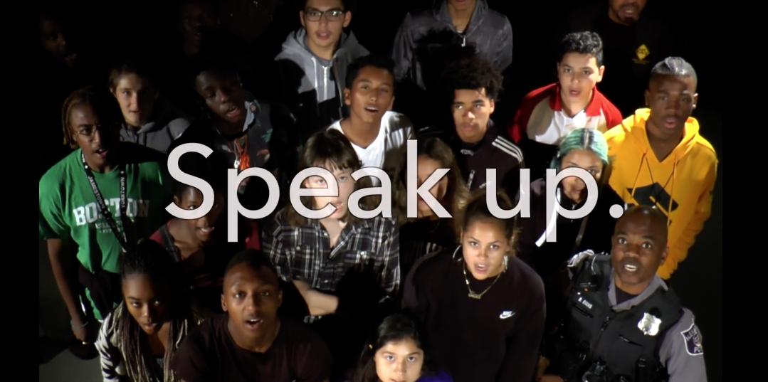 group of student with dark background and the words "speak up" overlayed