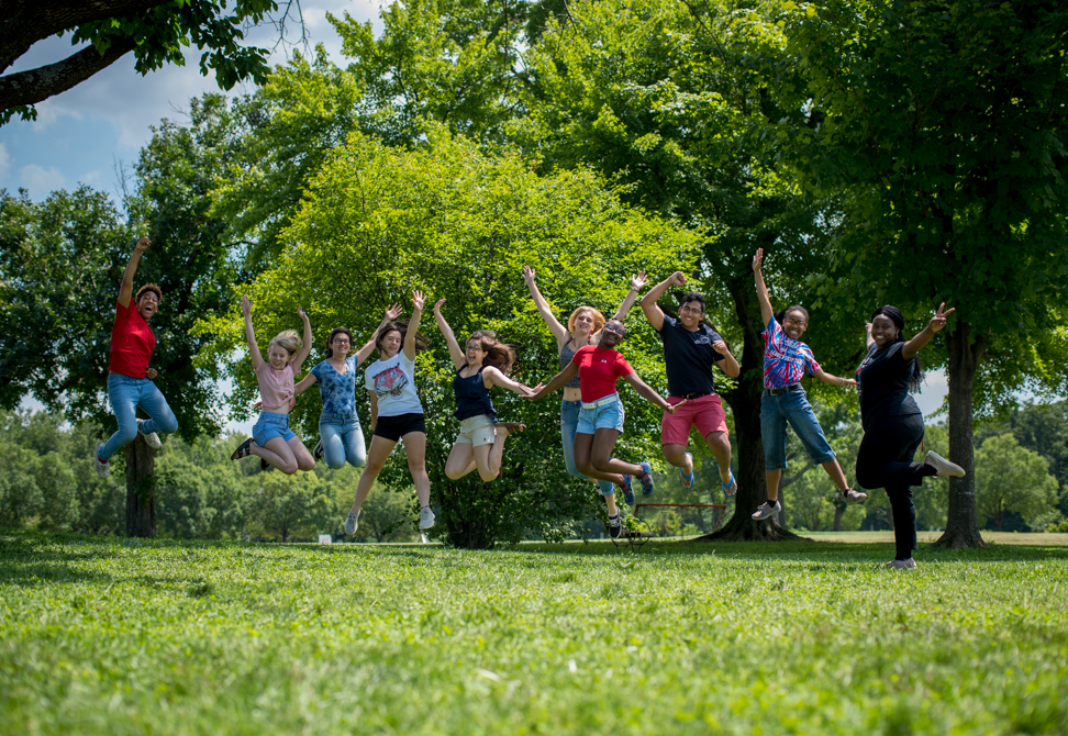 TC Williams students jump in the air