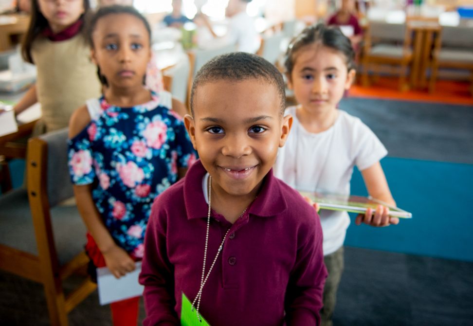 young boy and young girls in a classroom