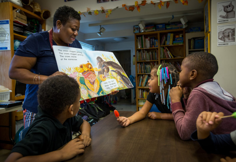 teacher reads to children