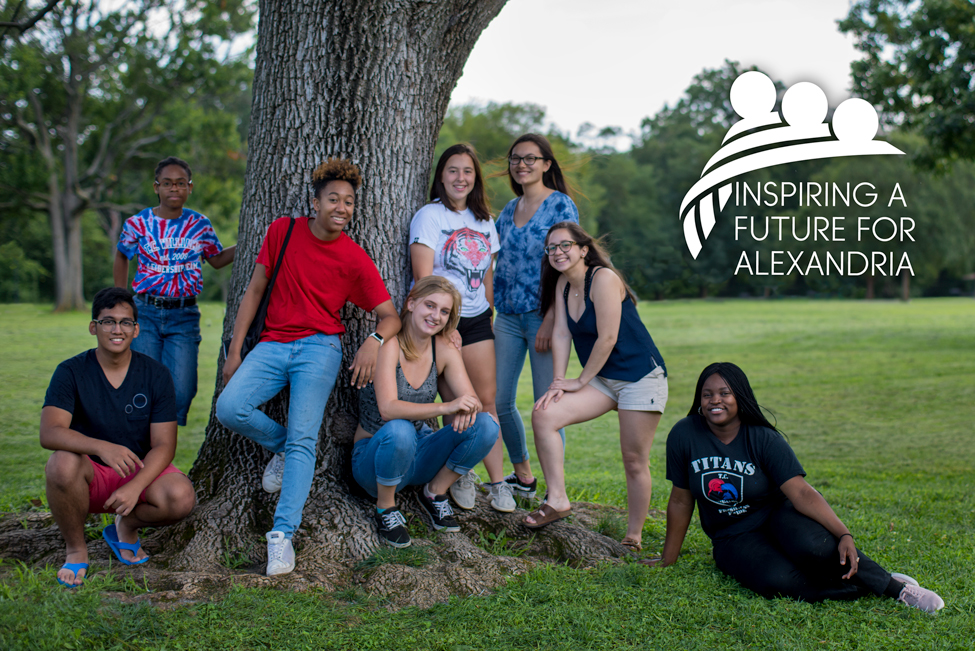 High school students posing under a tree