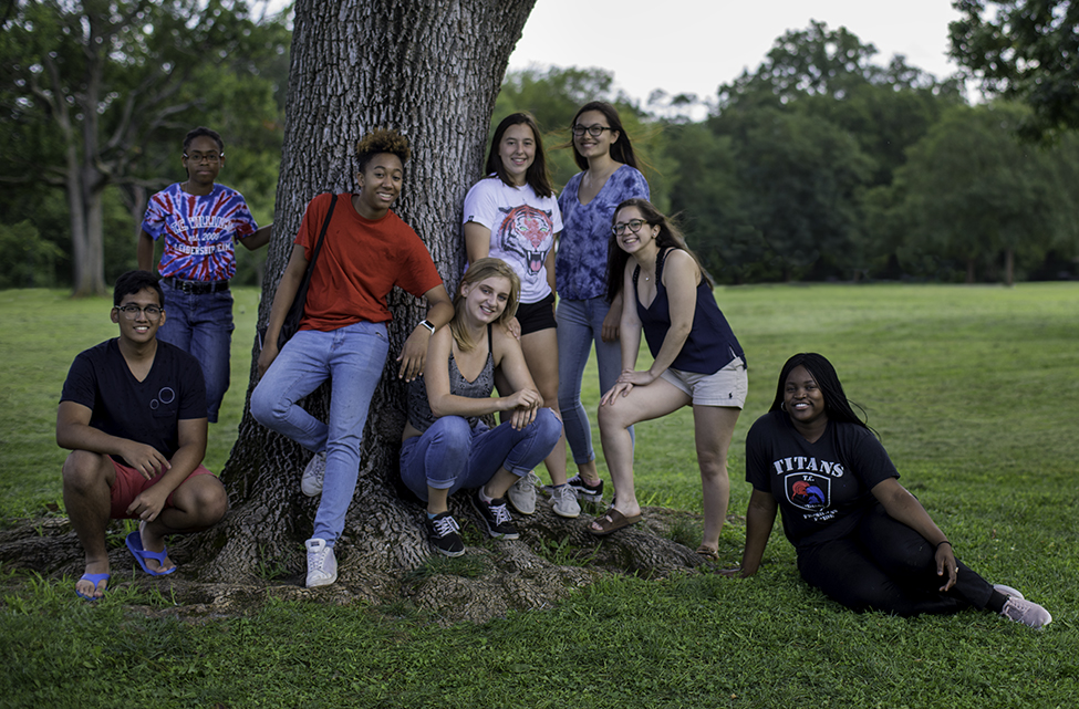 high school students by a tree