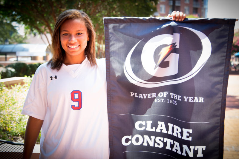 Claire Constant holding Gatorade Player of the Year banner.