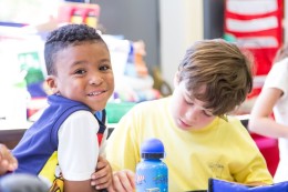 Two boys at table in school