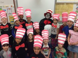 students in red and white hats