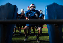 TC Williams football player doing drills at practice