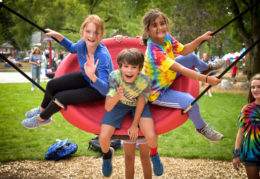 group of children on a giant swing