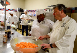 Chef in the TC kitchen with culinary students