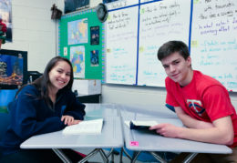 Paula and Paul sitting at their desks in German class