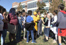 Jefferson-Houston School students in Halloween costumes outside sharing their thoughts on voting
