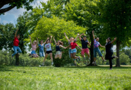 TC students jumping in the air