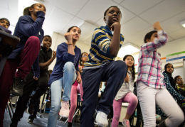 Students marching in place in the classroom