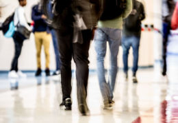 blurred image of feet in motion in hallway