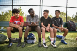 team members of International Academy at soccer field