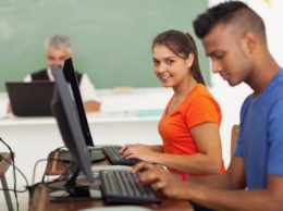 two high school students at computers