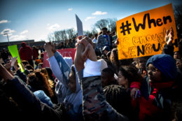 Students holding hands in a sign of unity against gun violence