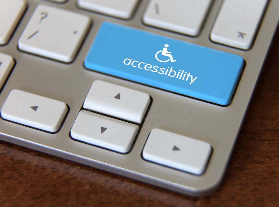 keyboard with blue button that says accessibility