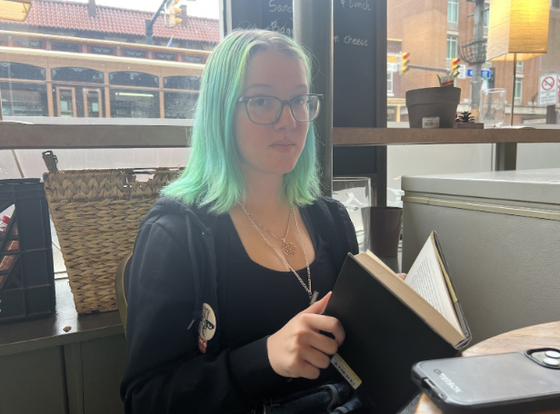 Nora sits in the Uptowner Cafe in Old Town, Alexandria.